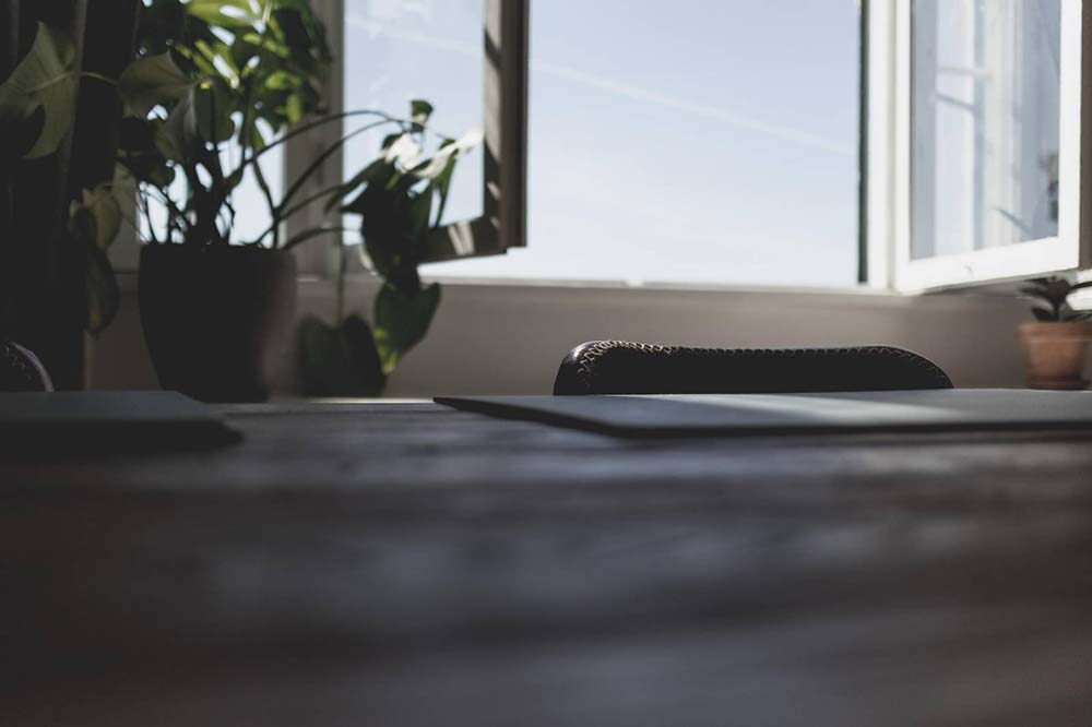 An open window behind a desk