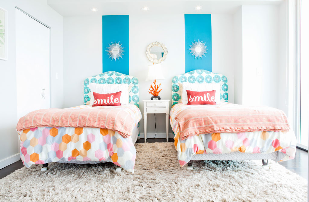 Photo of ridiculously colourful room with twin beds