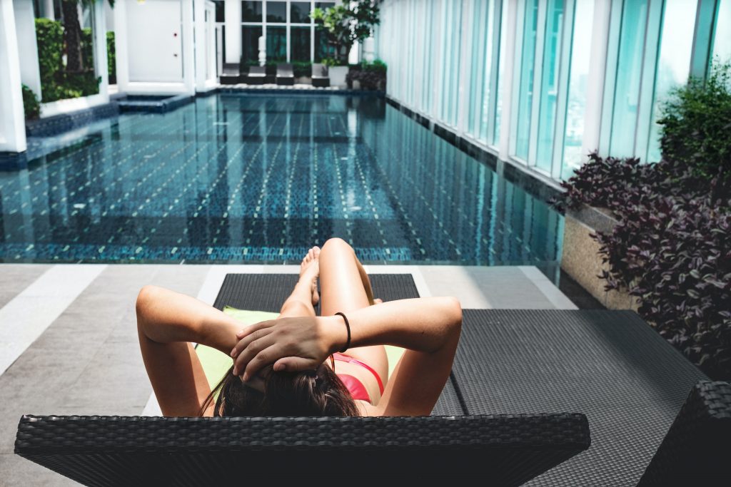 Woman relaxing on the poolside