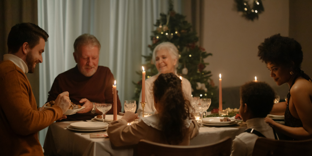 Family eating christmas dinner together.